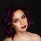 Portrait of beautiful fashion model with purple hair over g