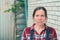 Portrait of beautiful female farmer in front of farmhouse shed