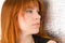 Portrait of beautiful ginger-haired woman with full sensuous lip
