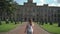 Portrait beautiful girl against backdrop facade beautiful architectural building