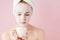 Portrait of beautiful girl in bathrobe with a cup of tea, relaxation concept blonde woman wearing bathrobe and towel on head after