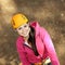 Portrait of beautiful girl in climbing gear. Beautiful girl climber climbs up the stairs.