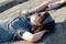 Portrait of beautiful girl relaxing lying on the walls facing the sun