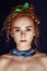 Portrait of a beautiful glamorous red-haired curly hair, close-up, beaut with handmade Beaded Necklaces