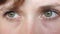 Portrait of beautiful gray-green eyes of a young beautiful woman. beautiful eyes girls closeup.