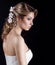 Portrait of beautiful happy gentle women bride in a white wedding dress c beautiful salon wedding hair with white flowers in her