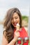 Portrait of beautiful happy smiling emotional young woman eating delicious ice cream