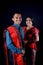 Portrait of beautiful indonesian couple wearing traditional batak costume isolated on black background