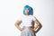 Portrait of beautiful korean girl pouting coquettish, looking at camera silly, standing in blue wig and party costume