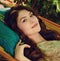 portrait of beautiful lady in the garden hammock, spring or summer seaason, outdoor portrait