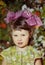 Portrait of a beautiful little girl with bows.