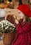 Portrait of a beautiful little girl with  flowers in autumn gazebo