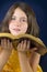 Portrait of beautiful little girl holding Holy Bible