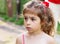 Portrait of beautiful little girl looking sad and afraid o