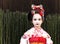 Portrait of beautiful little girl in Maiko kimono dress