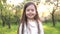 Portrait beautiful little girl smiling looking happy cute child having fun in sunny park outdoors