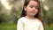 Portrait beautiful little girl smiling looking happy cute child having fun in sunny park outdoors