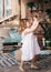 Portrait of beautiful little girl in summer gazebo