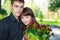 Portrait beautiful lovers young couple with a bouquet of red roses