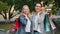 Portrait of beautiful mature ladies holding shopping bags smiling outdoors