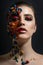 Portrait of a beautiful model with creative make-up made of various pasta pieces