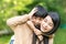 Portrait beautiful mother and child happily hugged in park. Asian family mom and child are hugging and looking at the camera, cute