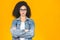 Portrait of beautiful positive african american curly woman standing with arms crossed