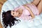 Portrait of beautiful pregnant brunette in pink delicate op