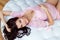 Portrait of beautiful pregnant brunette in pink delicate op