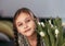 Portrait of beautiful pretty girl with white flowers tulips. Indoor photo