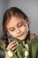 Portrait of beautiful pretty girl with white flowers tulips. Indoor photo