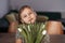 Portrait of beautiful pretty girl with white flowers tulips. Indoor photo