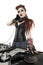 Portrait of beautiful punk DJ with sound mixing equipment over white background