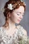 Portrait of beautiful red-haired bride. She has a perfect pale skin and delicate blush.