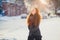 Portrait beautiful redhair girl in frosty winter weather.