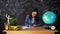 Portrait of a beautiful schoolgirl student , thinking about choosing a profession, on the background of a black Board