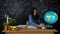 Portrait of a beautiful schoolgirl student , thinking about choosing a profession, on the background of a black Board