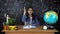 Portrait of a beautiful schoolgirl student , thinking about choosing a profession, on the background of a black Board