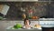 Portrait of beautiful smiling woman cook show above the table with vegetables in kitchen at home