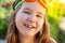 Portrait of a beautiful smilling little girl with goggles for swimming pool