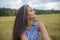 Portrait of a beautiful swarthy caucasian young woman on a background of a field, nature