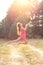 Portrait of Beautiful teenager girl  Is jumping and playing with ball at  summer sunset. Soft focused