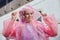 Portrait of beautiful teenager girl walking in rain dressed in raincoat