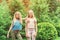 Portrait of beautiful teenager girls twins at park.