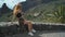 Portrait of a beautiful tourist woman in the Masca valley on the Canary island of Tenerife. The girl enjoys the