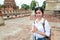 Portrait of beautiful traveler asian woman paying respect in ancient temple