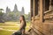 Portrait of beautiful Vietnamese millennial girl posing next to Angkor Wat, Siem Reap