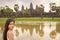 Portrait of beautiful Vietnamese millennial girl posing next to Angkor Wat, Siem Reap