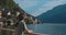 Portrait of beautiful woman enjoying magnificent view. Girl taking moment to admire inspiring landscape and sunbathing