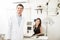 Portrait of beautiful woman and handsome optician in clinic